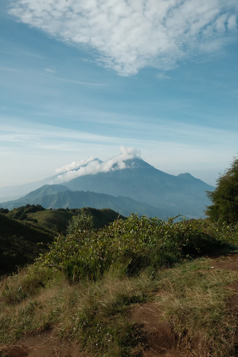 Layered mountain ridges and an open sky, seen from Mount Prau.